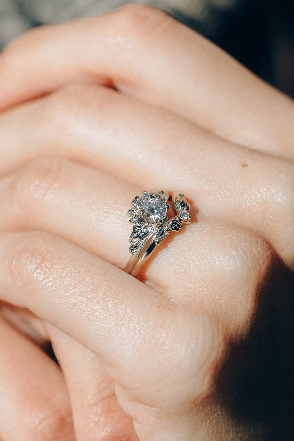 Round moissanite white gold engagement ring with tiny ivy leaves and diamonds / Ariadne