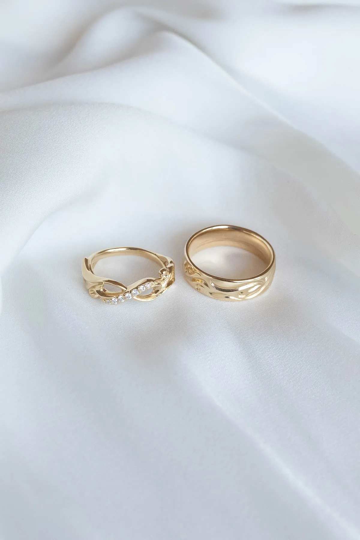 Wedding rings set for couples: gold band for him, infinity band with diamonds for her