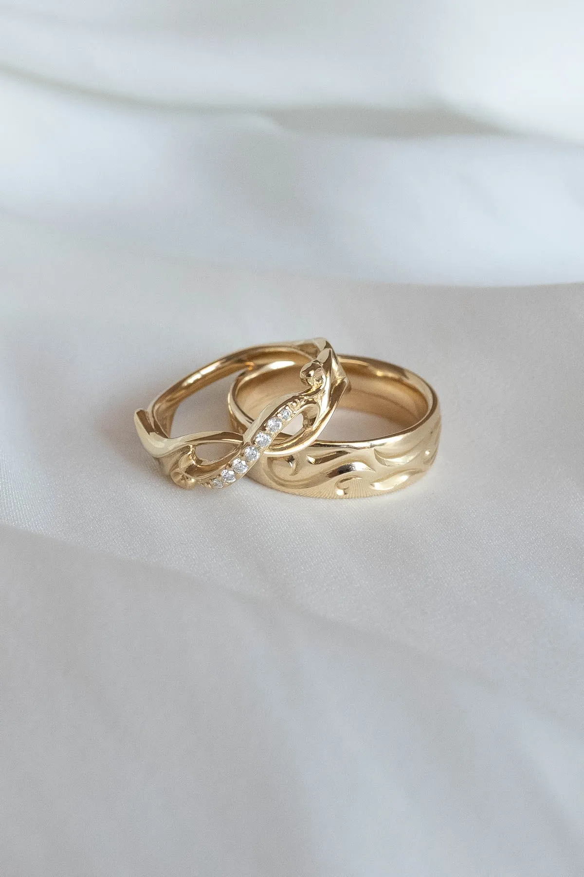 Wedding rings set for couples: gold band for him, infinity band with diamonds for her