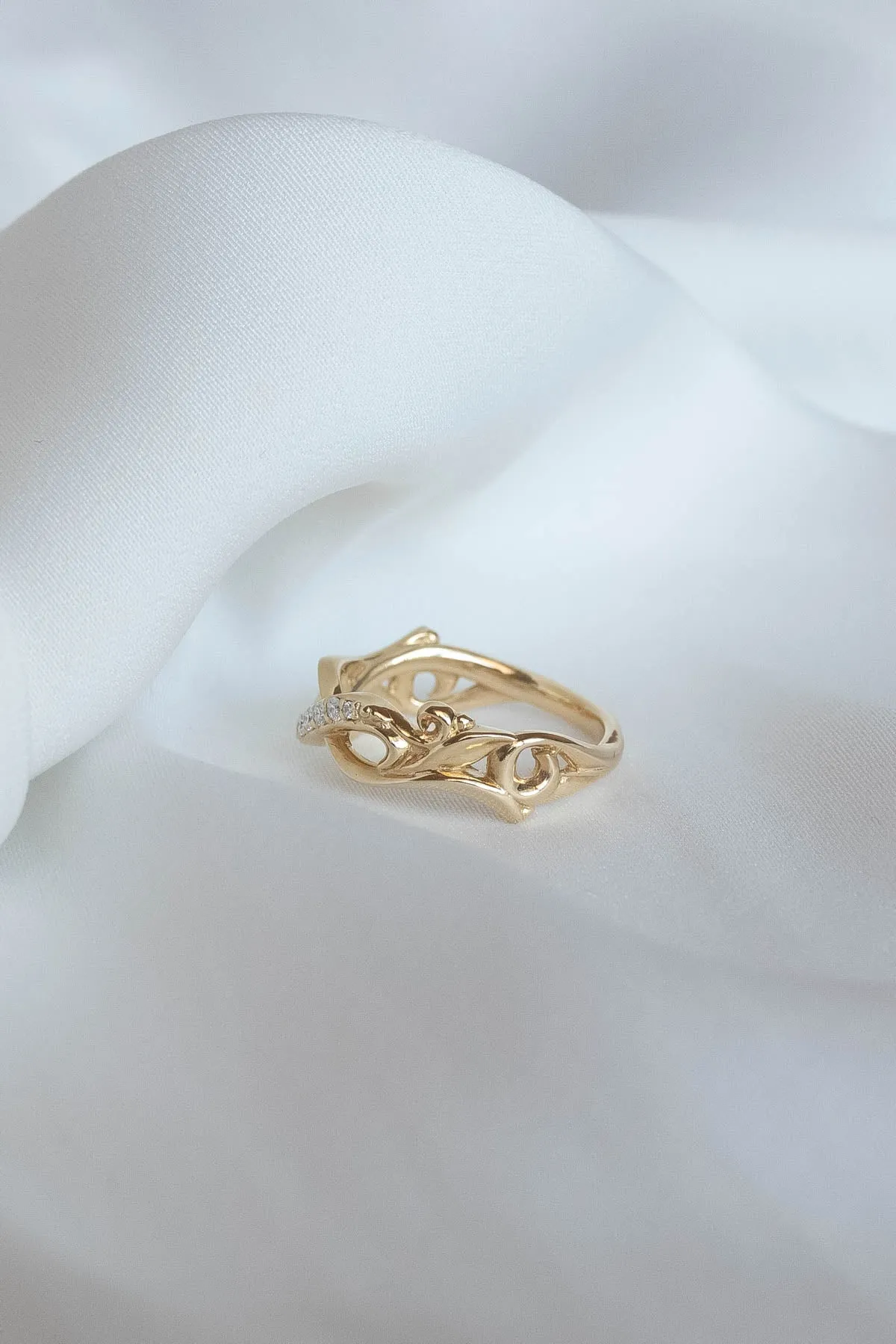 Wedding rings set for couples: gold band for him, infinity band with diamonds for her